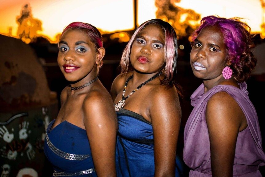A photo of three female models taking part int he Kiwirrkurra Fashion Show