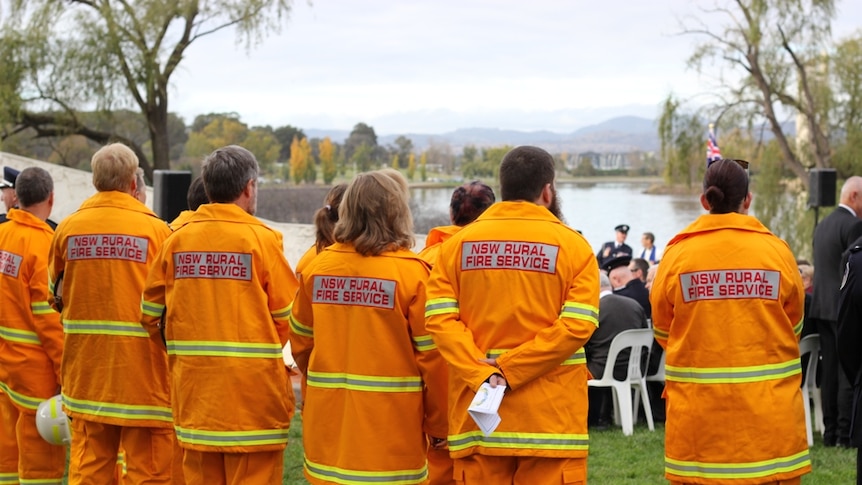 Members of the Lake George Zone NSW Rural Fire Service team await the Prime Minister’s arrival.