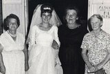 A black-and-white photo of four women at a wedding in 1966