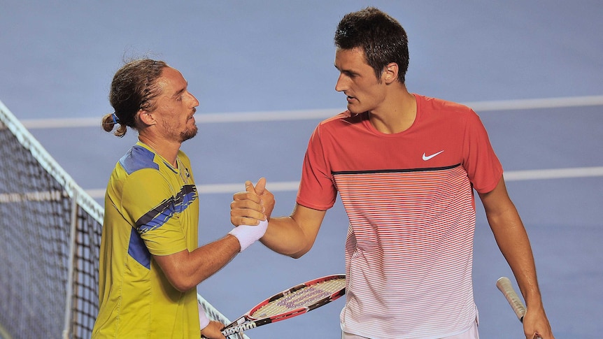 Australia's Bernard Tomic shakes hands with Ukraine's Alexandr Dolgopolov after Acapulco Open semi.