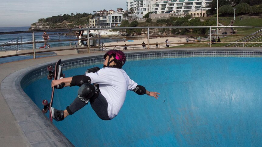 Amar Hadid balances on the edge of the skate bowl
