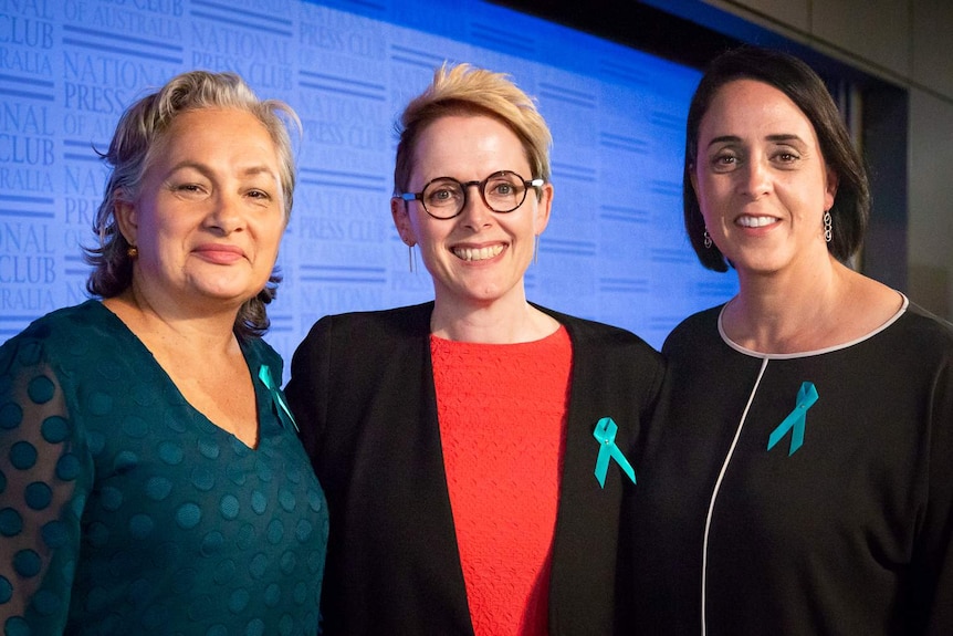 Jill Emberson alongside National Press Club president Sabra Lane and fellow speaker Nicole Livingstone.