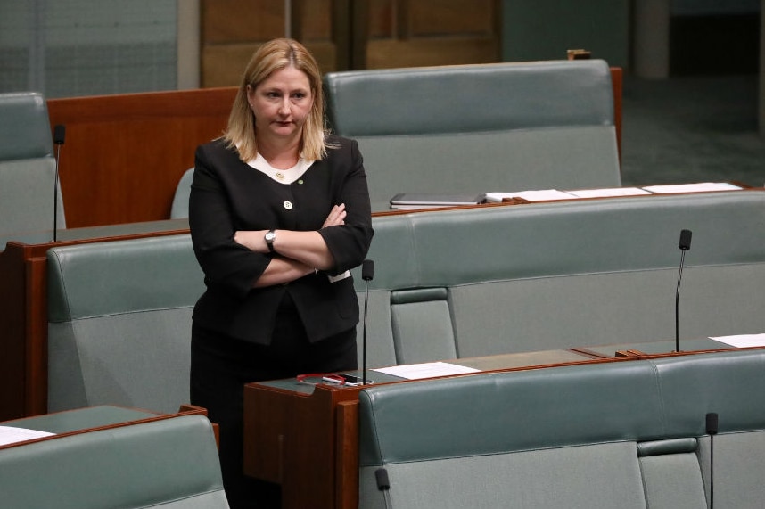 Rebekha Sharkie stands and crosses her arms in Parliament.