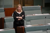 Rebekha Sharkie stands and crosses her arms in Parliament.