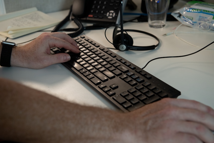 A picture of a hand on a keyboard