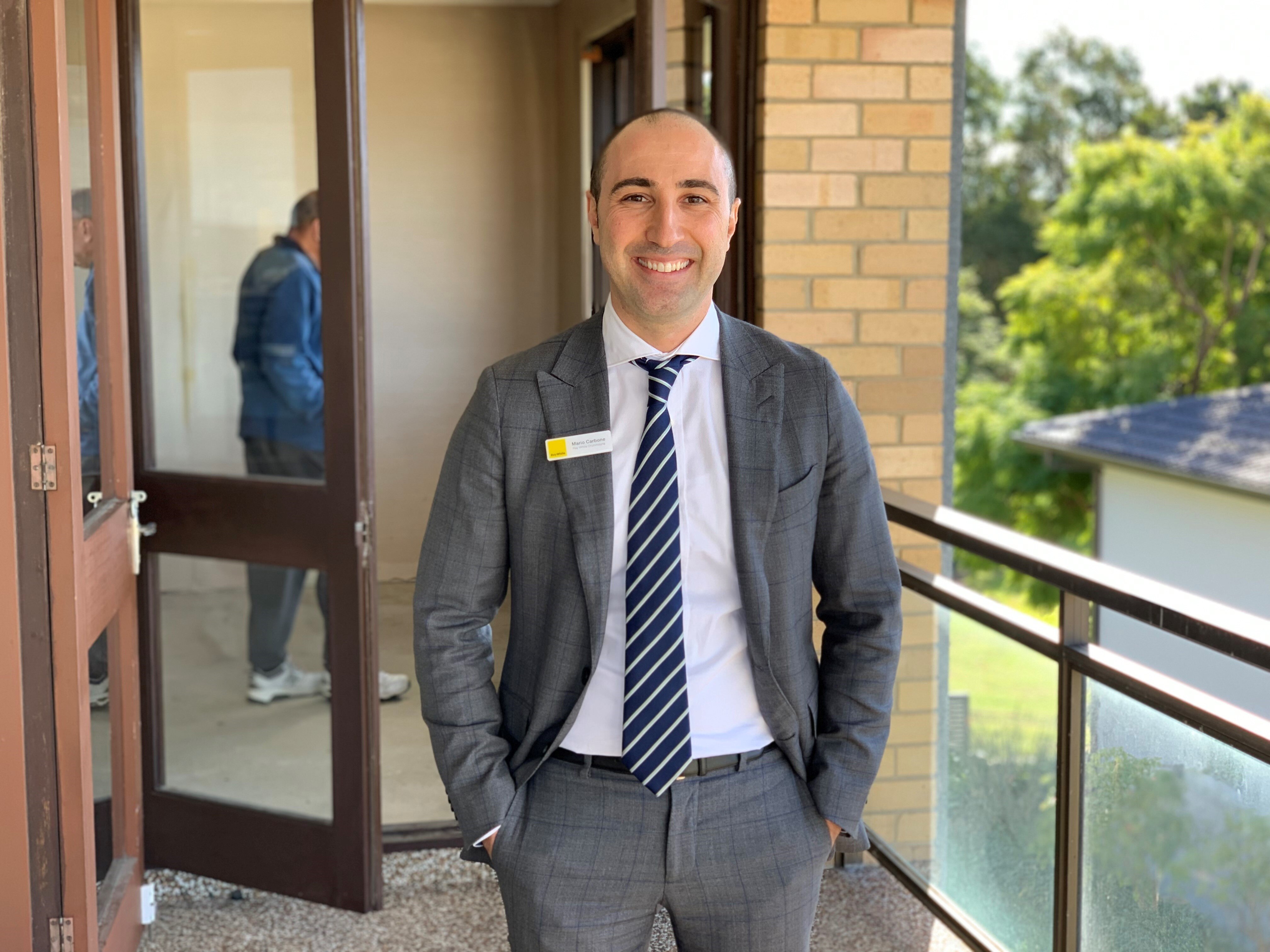 A man wearing a suit and tie