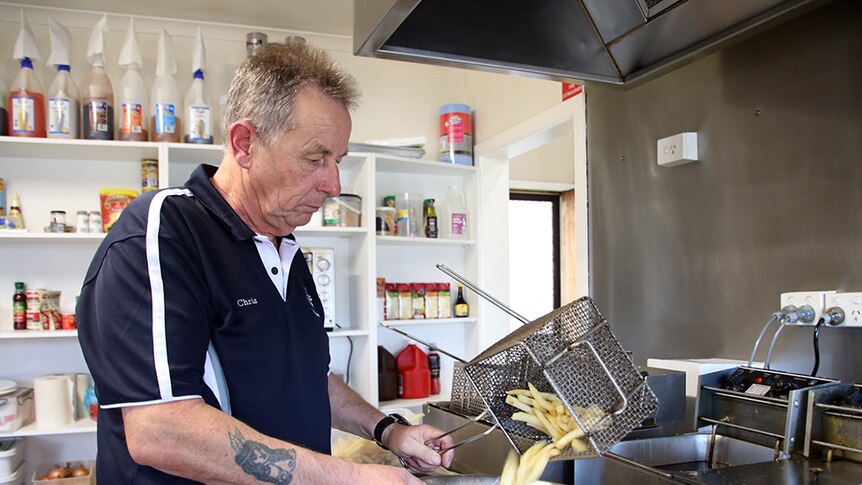 Former TEMCO supervisor Chris Hogan makes chips in his cafe