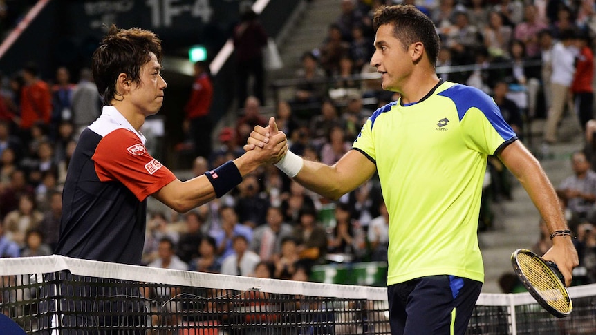 Japan's Kei Nishikjori (L) shakes hands with Spain's Nicolas Almagro after losing in the Japan Open.