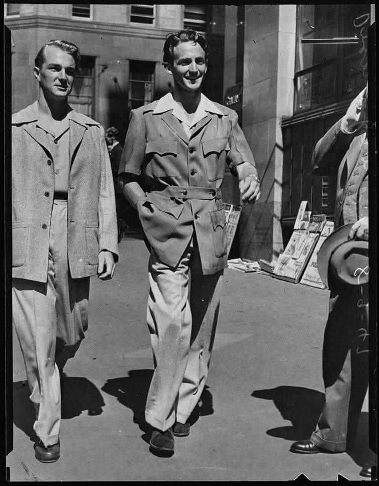 Two men wearing more relaxed suits