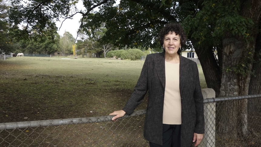 Bungendore Abbeyfield Committee chair Anna Goonan in front of the vacant block of land.