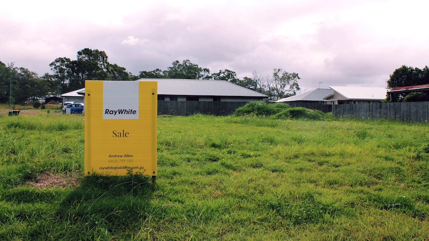 A 'sale' real estate agent sign on an empty block of land in Gladstone.