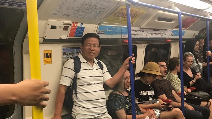 Chau Van Kham rides the London Underground during a visit to the UK last year.