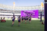 Fremantle Dockers run onto Perth Stadium for AFLW match