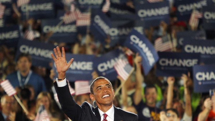 Senator Barack Obama waves to the crowd before giving his acceptance speech