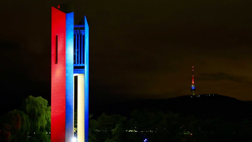 The National Carillon and Telstra Tower in Canberra lit up with blue, white and red lights following the Paris attacks.