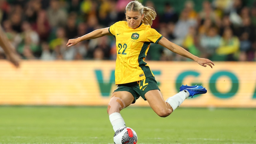 A Matildas player kicks the ball with her left foot in an international.