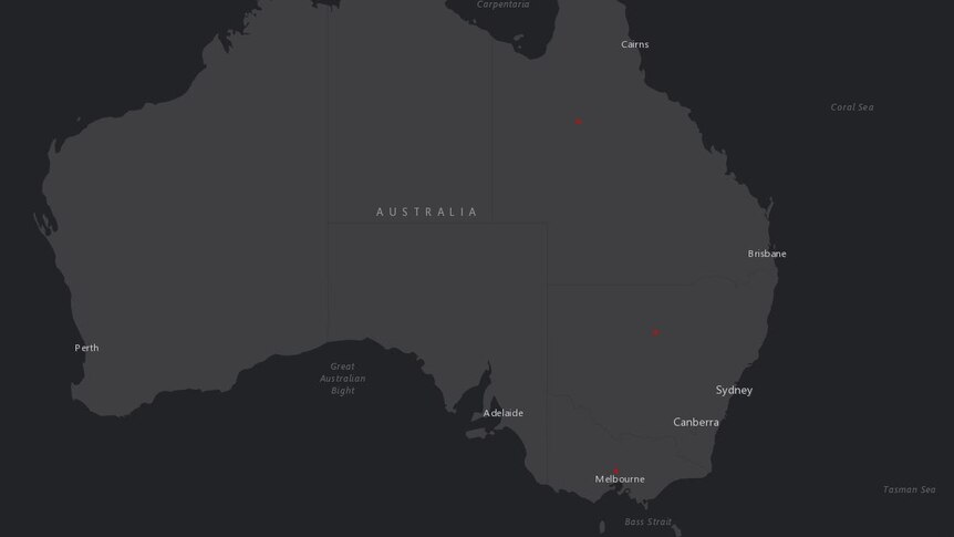 A black and grey map of Australia with three red dots in the centre of Queensland, NSW and Victoria.
