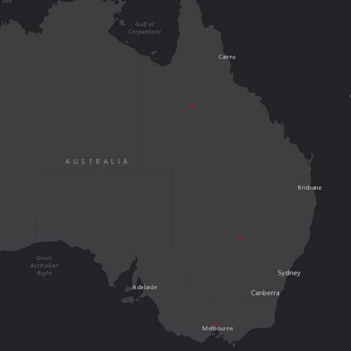 A black and grey map of Australia with three red dots in the centre of Queensland, NSW and Victoria.