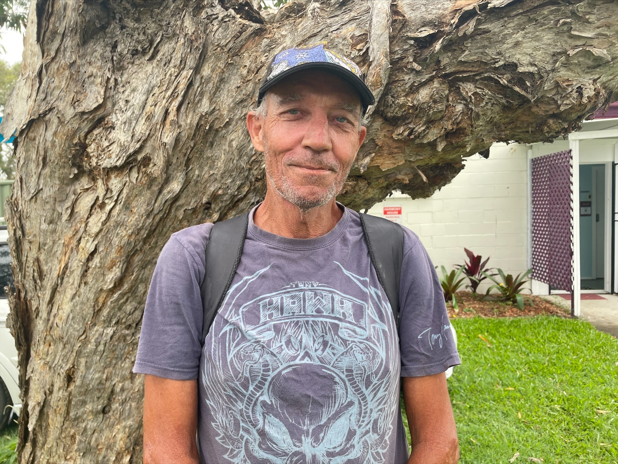 Man in cap and wearing a backpack