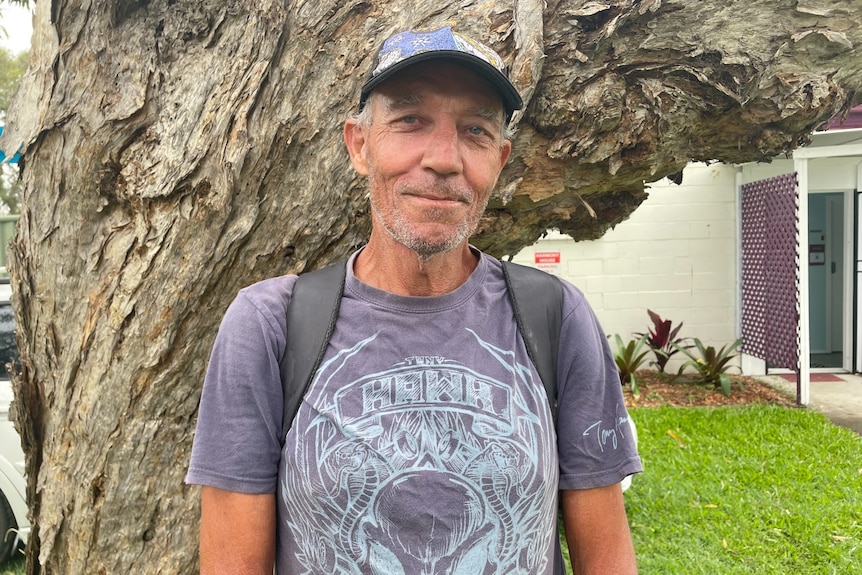 Man in cap and wearing a backpack