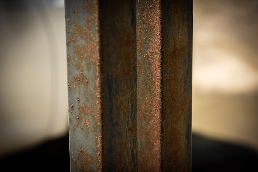 Rusted metal beam.
