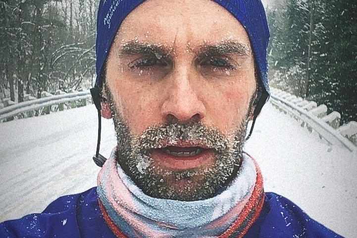 man with frozen beard in snow