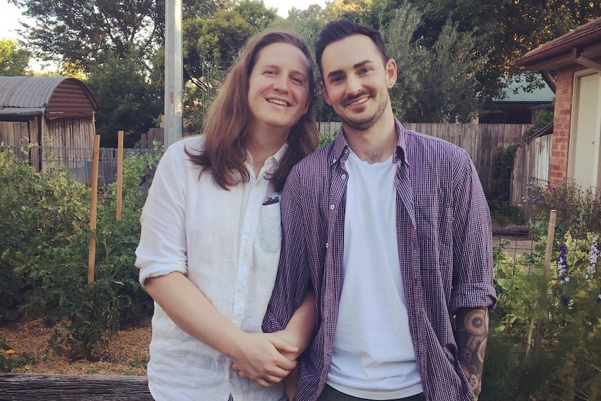 Canberra gardeners Connor Lynch and Ky Ruprecht pose in front of their first veggie patch, in the backyard of their rental home.