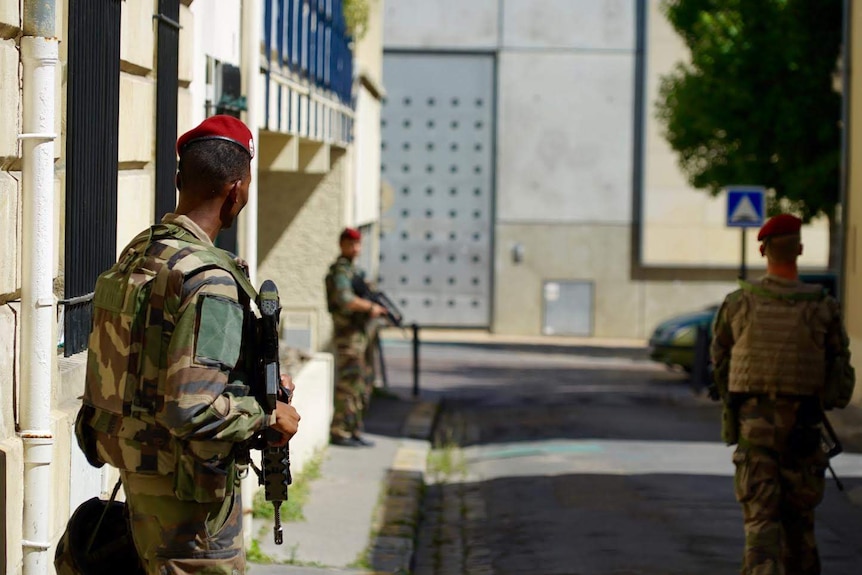 Soldiers stand guard outside Bordeaux mosque