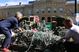Greens senator Nick McKim showing marine debris.