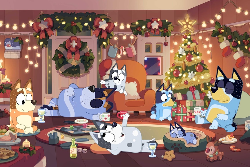 Bluey and family lie around the Christmas tree contentedly with decorations everywhere.