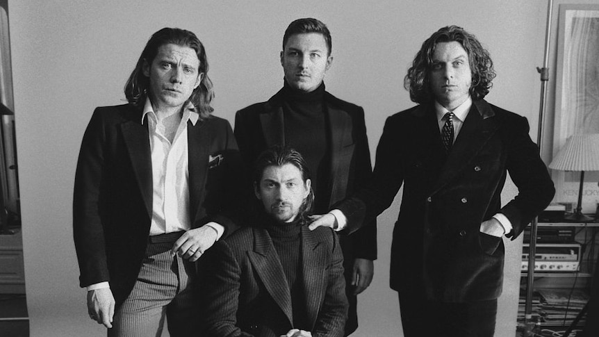 Black and white photo of Arctic Monkeys in a photography studio