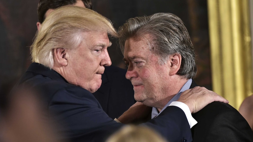 Donald Trump congratulating his advisor Steve Bannon at the White House in 2017