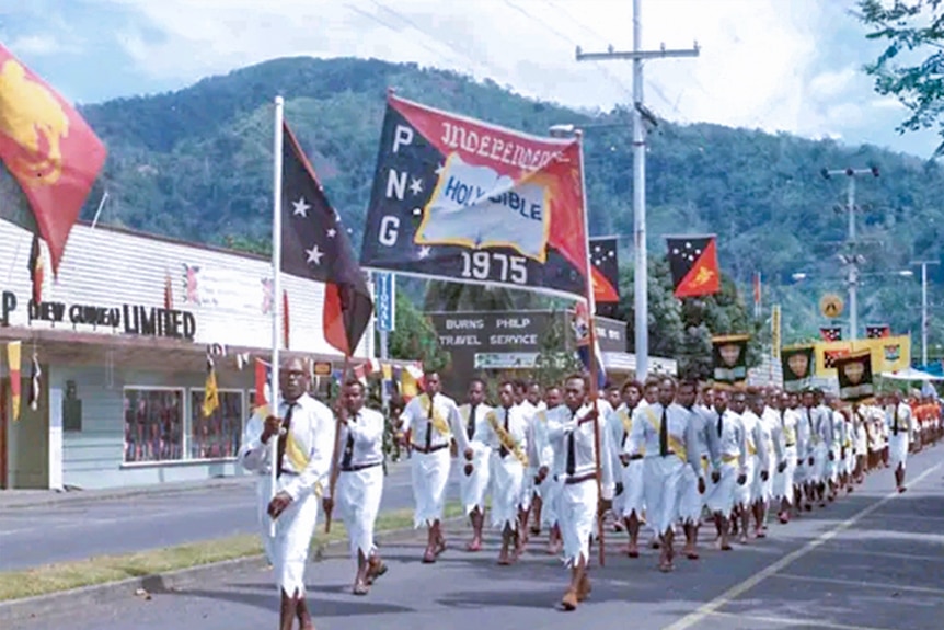 An Independence Day parade on Mango Avenue, Rabaul, before the eruption. (Supplied: Rabaul Historical Society)