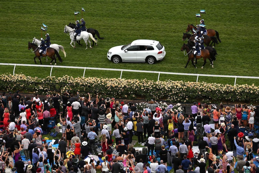 Prince Charles and Camilla arrive at Flemington