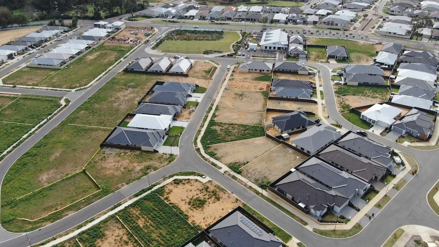 An aerial photograph of an outer-suburb of Perth, with small vacant lots among new houses on the rural-urban fringe.