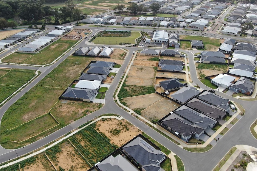 An aerial photograph of an outer-suburb of Perth, with small vacant lots among new houses on the rural-urban fringe.