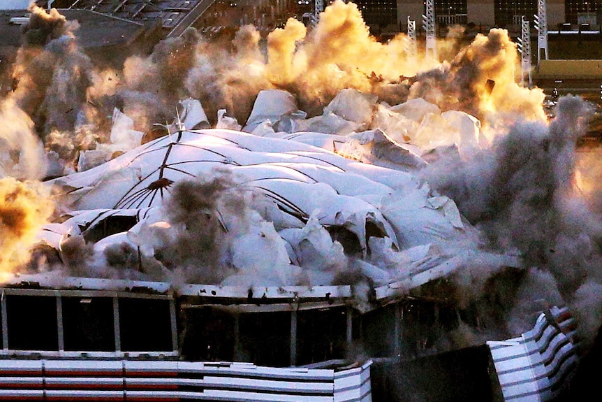 Smoke and debris rises from Atlanta Dome as it falls