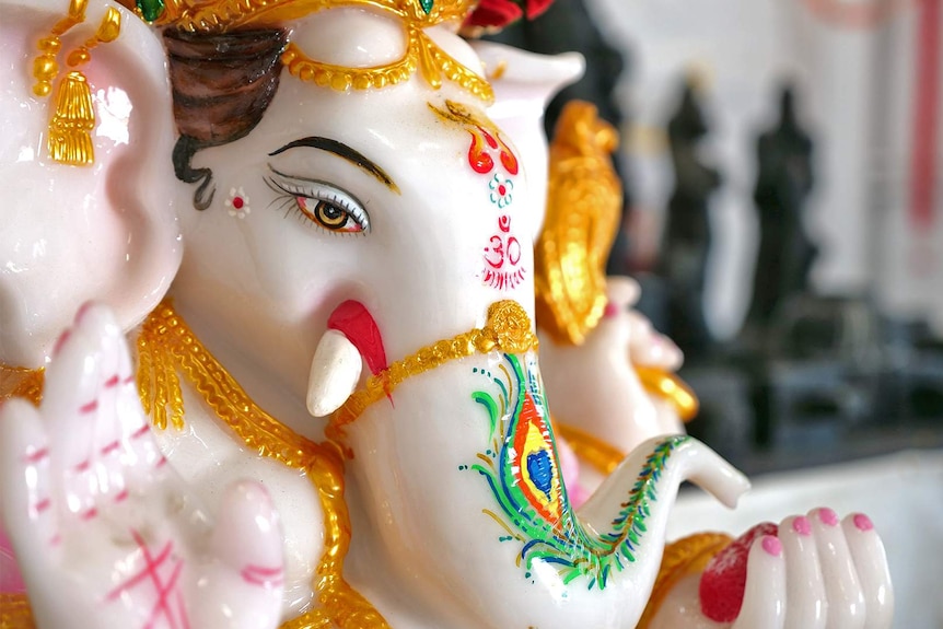 Close up of a porcelain Lord Ganesha Deity.