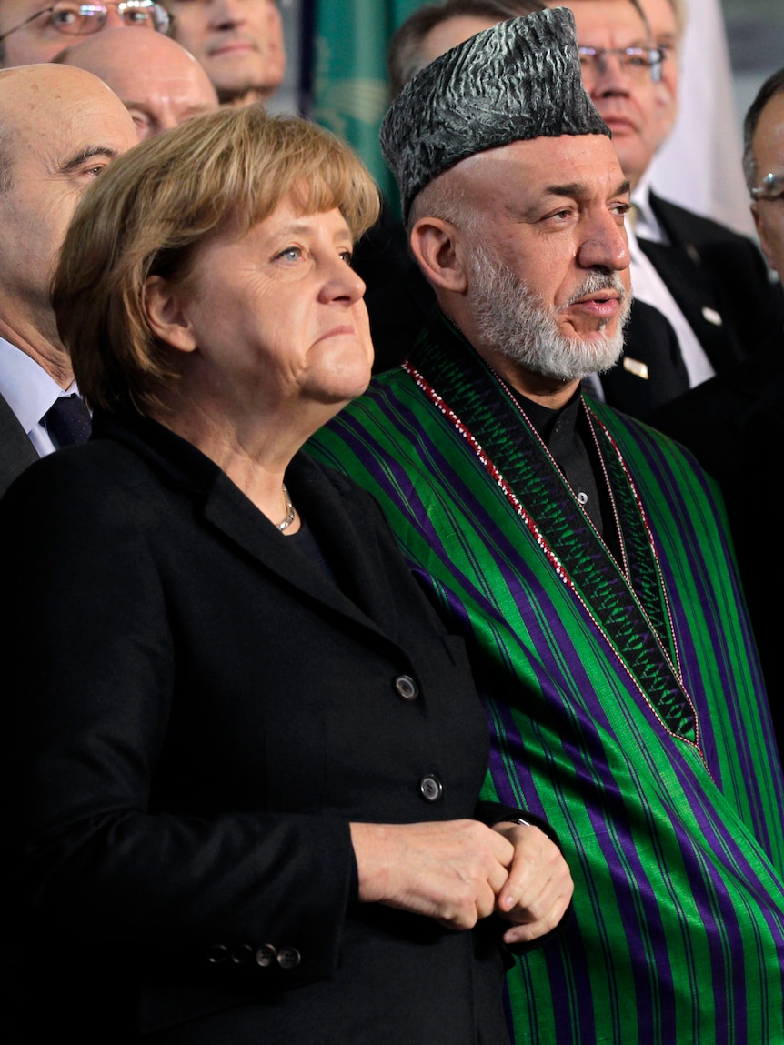 German Chancellor Angela Merkel and Afghan president Hamid Karzai in Bonn