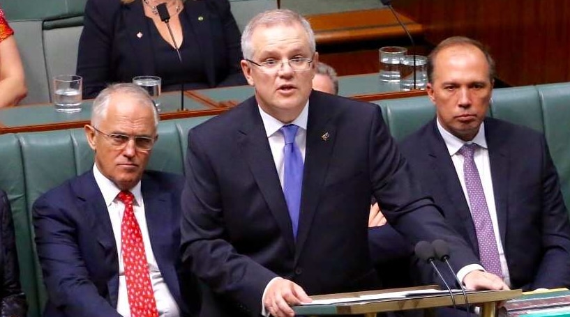 Scott Morrison delivers the budget with Malcolm Turnbull behind him