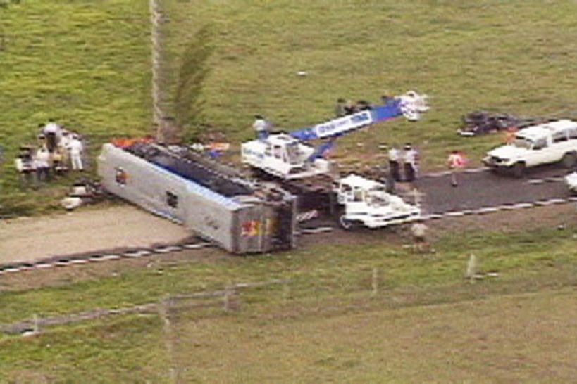 The Sunliner bus on its side, in Cowper, near Grafton.