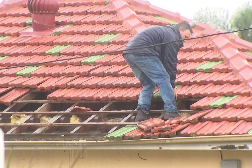 man on a roof