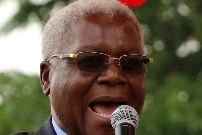 Former Zimbabwe Finance Minister Ignatius Chombo speaks at a rally.