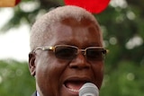 Former Zimbabwe Finance Minister Ignatius Chombo speaks at a rally.