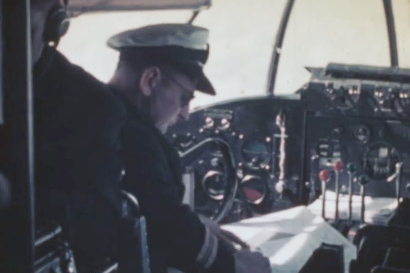 A man in a plane's cockpit