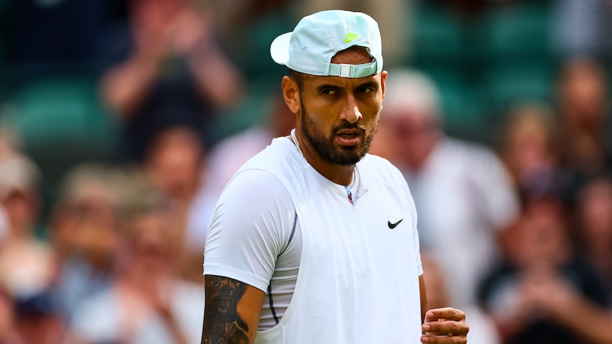 An Australian male tennis players looks to his right after winning Wimbledon quarterfinal.