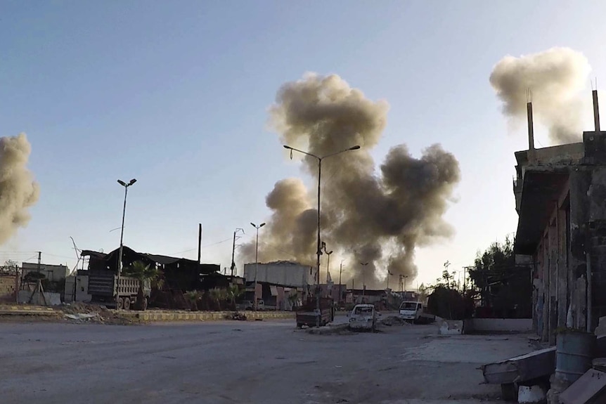 Smoke rising after Syrian government airstrikes hit Douma, in eastern Ghouta region east of Damascus, Syria, April 7, 2018