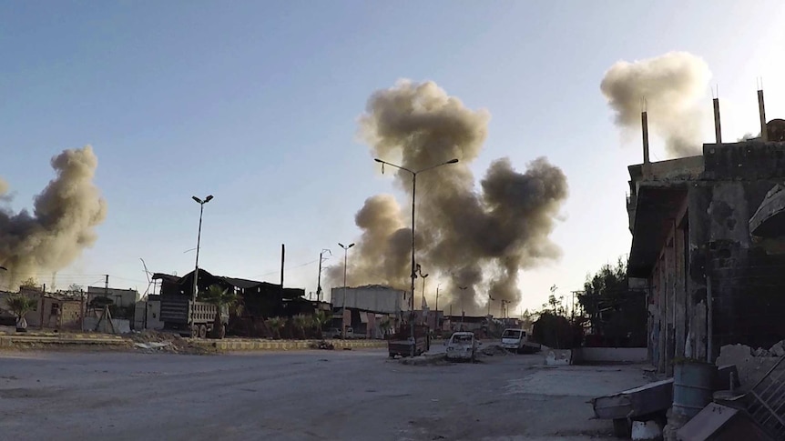 Smoke rising after Syrian government airstrikes hit Douma, in eastern Ghouta region east of Damascus, Syria, April 7, 2018