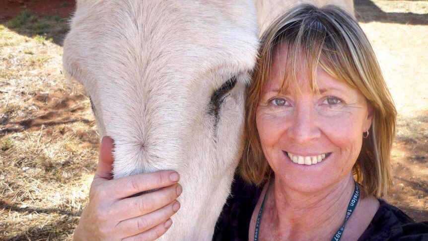 Health worker Gayle Woodford with a horse