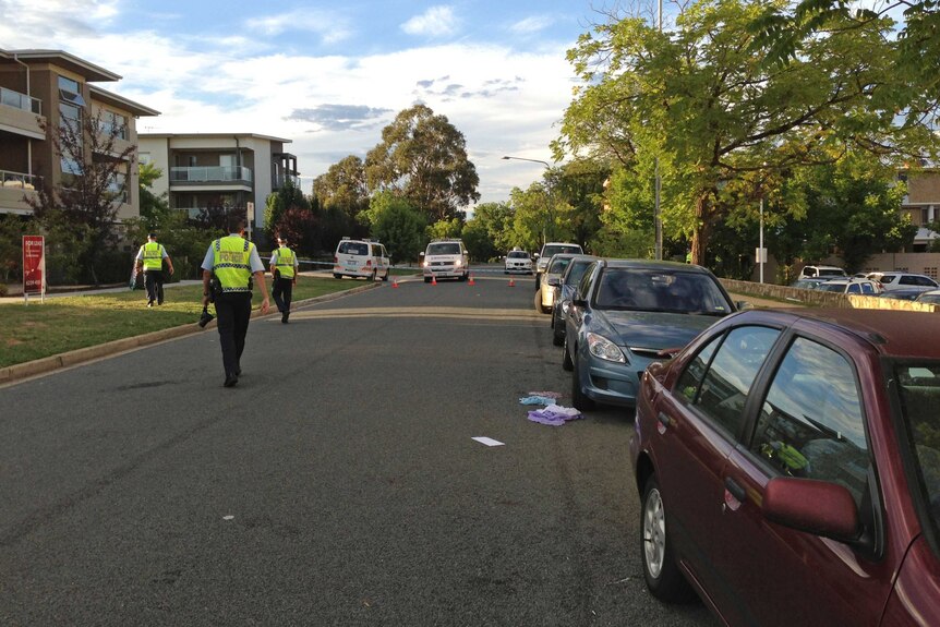 Officers look for evidence at the scene of an early morning hit-and-run near the Rex Hotel in Braddon in February 2013.